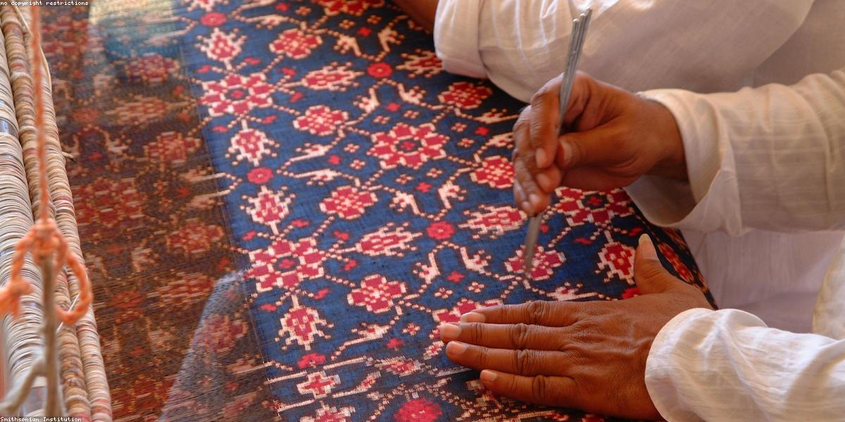 Antique Persian rug being restored